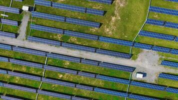 Top view on the field with many solar panels. Alternative clean electricity. Aerial view. Camera is moving around. video