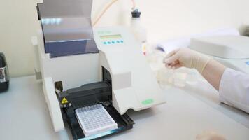 Medical device at work in lab. Automated machine for testing various samples in modern clinic. Laboratory equipment. video
