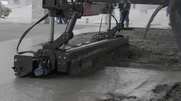 The Automated Concrete Paving Process Implemented at a Construction Site Enhances Efficiency. Clip video