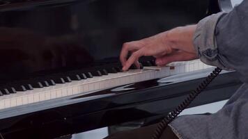 A Close Up View of Hands Passionately and Skillfully Playing Beautiful Piano Keys with Deep Emotion. Clip video