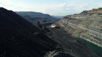Aerial View of a Vast Open Pit Coal Mine Featuring Various Heavy Machinery in Operation. Stock Clip video