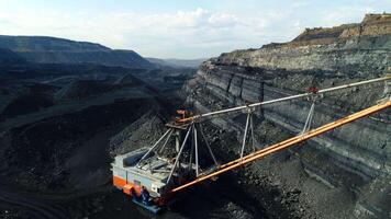 A breathtaking Aerial View of a Coal Mining Operation taking place in a large Quarry. Stock Clip video