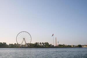 Sharjah cityscape with UAE flag. photo