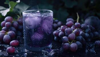 A Glass of Icy Grape Juice with Fresh Grapes and Ice Cubes photo