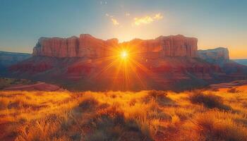 Sunset Over Red Rock Cliffs with Golden Grass photo