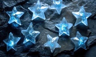 A group of blue ice stars on a rock photo