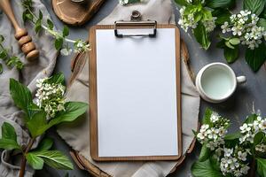Rustic Spring-Themed Mockup with Wooden Clipboard and Blossoming Branches for Design Projects photo