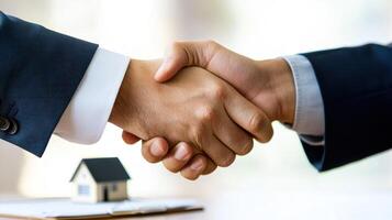 handshake between client and loan officer symbolizes trust and agreement photo