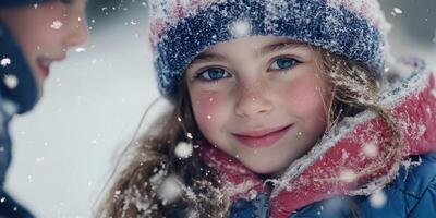 Close-up image of a young girl playing in the snow with her friends. photo