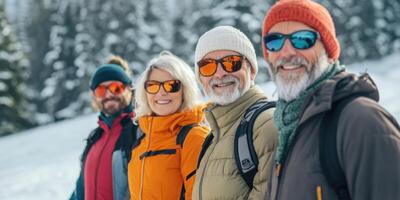 Group of middle-aged couples on a skiing vacation in the mountains. photo