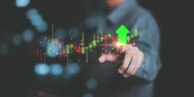 Businessman showing business growth and success graph ,concept of progress in development, financial efficiency and investment with business strategy for goals and opportunities in the industry future photo