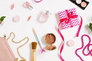 Spring composition of cosmetic and present box. Flat lay and top view photo