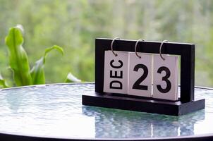 23 December calendar on marble table with customizable space for text. December calendar concept photo