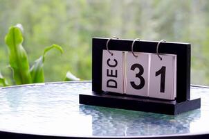 31 December calendar on marble table with customizable space for text. December calendar concept photo
