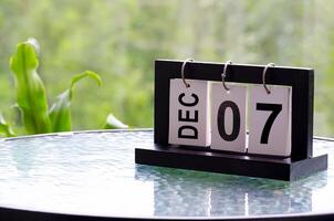 7 December calendar on marble table with customizable space for text. December calendar concept photo