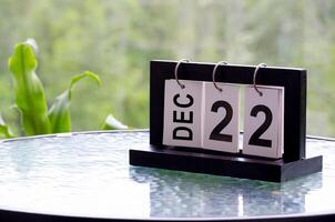 22 December calendar on marble table with customizable space for text. December calendar concept photo