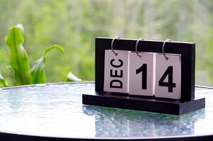 14 December calendar on marble table with customizable space for text. December calendar concept photo
