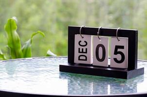 5 December calendar on marble table with customizable space for text. December calendar concept photo