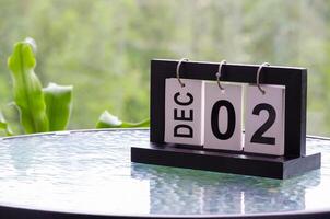 2 December calendar on marble table with customizable space for text. December calendar concept photo