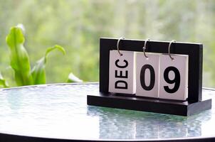 9 December calendar on marble table with customizable space for text. December calendar concept photo