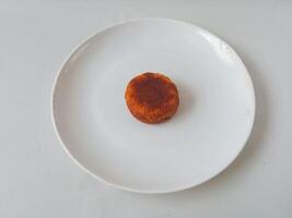 Wingko babat. Indonesian traditional food made from sticky rice isolate on white background. typical food photo