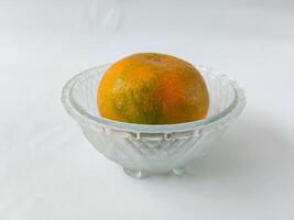 orange fruit on plate isolate on white background photo