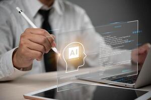 A man using a pen to draw a head on a laptop screen photo