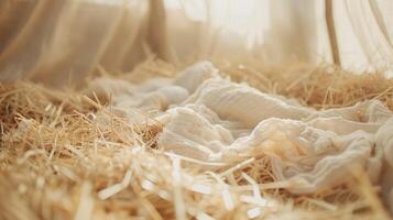 Straw stable with a white cloth Nativity scene photo