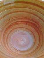 A bowl with a swirl pattern on it photo