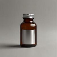 A small bottle of liquid on a gray background photo