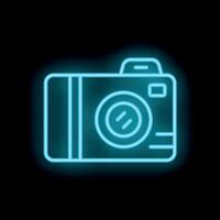 Blue neon sign camera icon glowing on black background vector