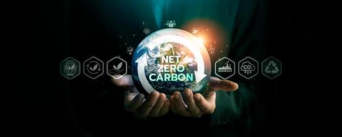 Hands Holding Earth with Net Zero Carbon Concept, Surrounded by Eco-Friendly Icons Representing Renewable Energy, Sustainability, and Climate Change Solutions for a Greener and Carbon-Neutral Future photo