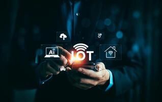 Businessman Using Smartphone to Access Internet of Things IoT with AI, Cloud, Smart Home, and Connected Devices Technology Icons Highlighting Digital Innovation and Connectivity photo