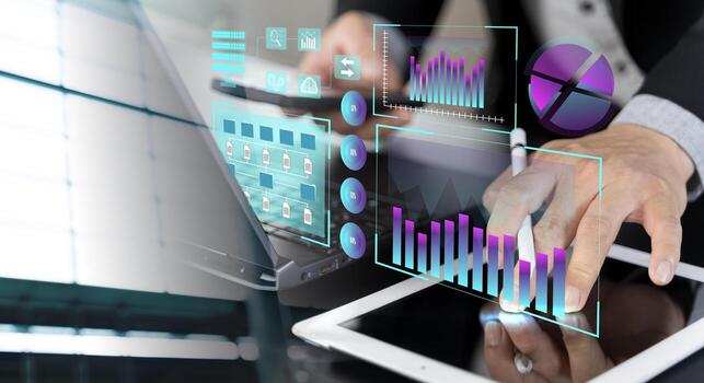 Businessman using laptop computer analyzing sales data and financial growth graph chart report. photo