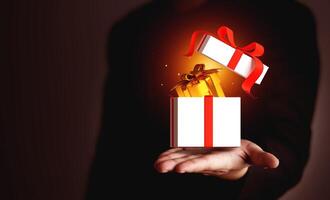Businessman showing gift box on hand with copy space. Business concepts, annual bonuses, employee benefits, company gift exchange, and No Gift Policy photo