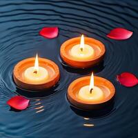 Serene water candles surrounded by floating rose petals for relaxation. photo