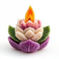 A beautifully crafted lotus candle symbolizing peace and enlightenment. photo