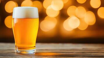 Refreshing craft beer with frothy head against a blurred golden bokeh background photo