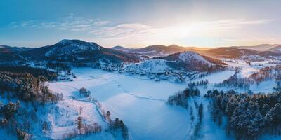Panoramic drone view of snowy mountains photo