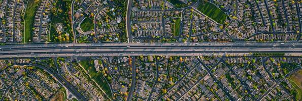 Urban Sprawl with Roads and Highways. A top-down drone view of a sprawling city, residential blocks photo