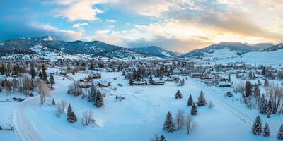 Panoramic drone view of snowy mountains photo