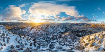 Panoramic drone view of snowy mountains photo