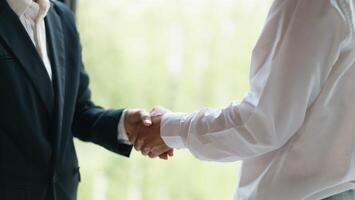 Businessman shaking hands successful making a deal. mans handshake. Business partnership meeting concept photo