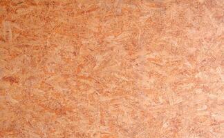 Seamless compressed wood particle board texture background. OSB oriented strand wooden board backdrop. photo