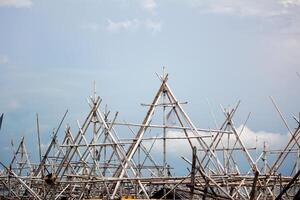 Intricate Bamboo Scaffolding Structure Above the Sea photo