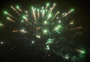 Green fireworks sparks exploding on the dark sky photo