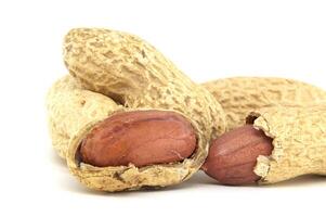 Close-Up of Peanuts in Shell on White Background photo