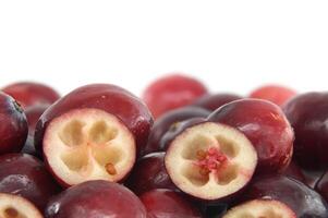 Fresh Cranberries With Halved View Displaying Seeds and Flesh photo