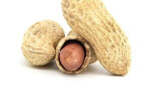 Close-Up of Shelled Peanuts on White Background for Food Concepts photo