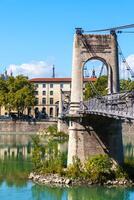 Old Passerelle du College bridge over Rhone river in Lyon, France photo